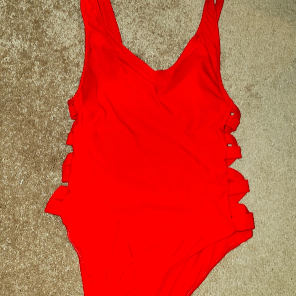 Red one piece bathing suit with slits down the sides